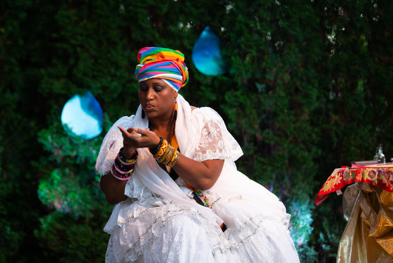FIRE FLOWERS AND A​ ​TIME MACHINE // FLORES DE FUEGO Y UNA MÁQUINA DEL TIEMPO by Shey Rivera Ríos, presented by The Wilbury Theatre Group in collaboration with WaterFire Providence; photo by Erin X. Smithers. (Providence, RI)
