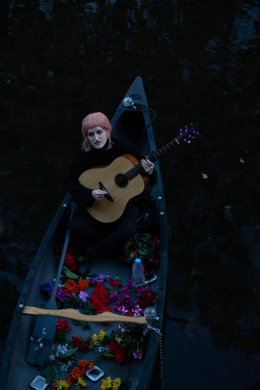 FIRE FLOWERS AND A​ ​TIME MACHINE // FLORES DE FUEGO Y UNA MÁQUINA DEL TIEMPO by Shey Rivera Ríos, presented by The Wilbury Theatre Group in collaboration with WaterFire Providence; photo by Erin X. Smithers. (Providence, RI)