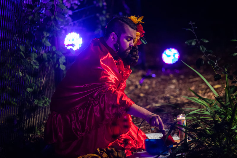 FIRE FLOWERS AND A​ ​TIME MACHINE // FLORES DE FUEGO Y UNA MÁQUINA DEL TIEMPO by Shey Rivera Ríos, presented by The Wilbury Theatre Group in collaboration with WaterFire Providence; photo by Erin X. Smithers. (Providence, RI)