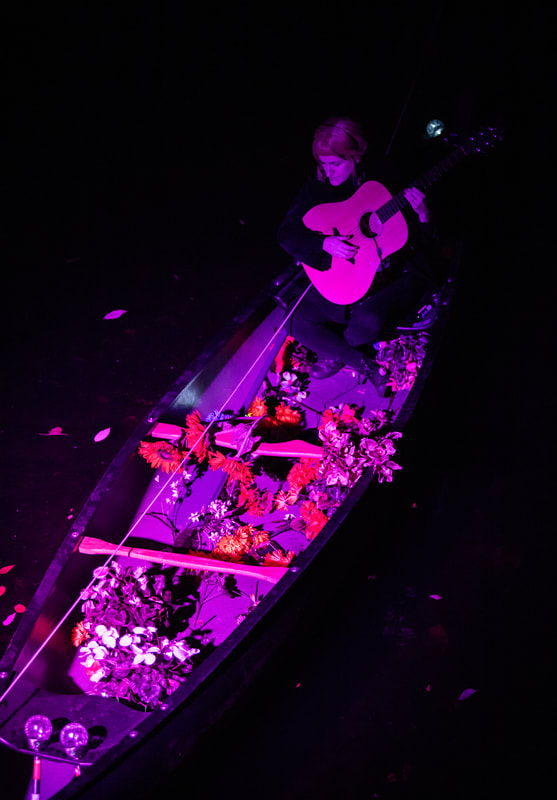 FIRE FLOWERS AND A​ ​TIME MACHINE // FLORES DE FUEGO Y UNA MÁQUINA DEL TIEMPO by Shey Rivera Ríos, presented by The Wilbury Theatre Group in collaboration with WaterFire Providence; photo by Erin X. Smithers. (Providence, RI)