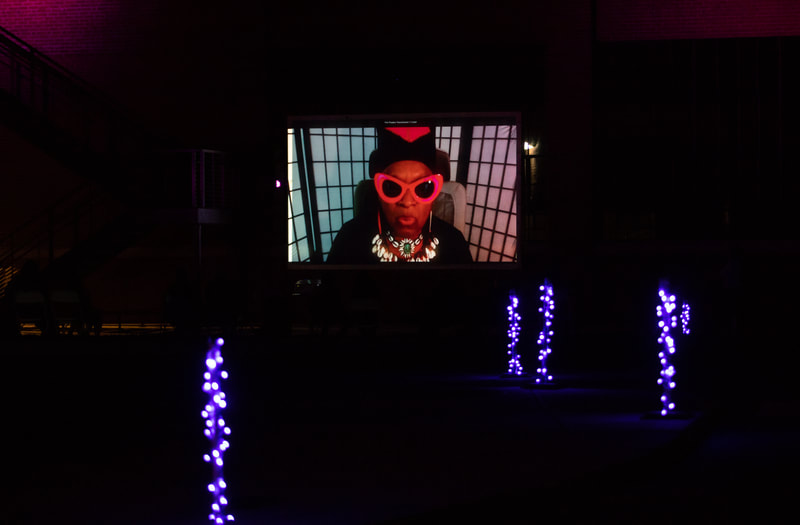 FIRE FLOWERS AND A​ ​TIME MACHINE // FLORES DE FUEGO Y UNA MÁQUINA DEL TIEMPO by Shey Rivera Ríos, presented by The Wilbury Theatre Group in collaboration with WaterFire Providence; photo by Erin X. Smithers. (Providence, RI)