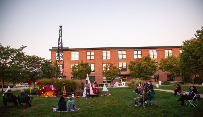 FIRE FLOWERS AND A​ ​TIME MACHINE // FLORES DE FUEGO Y UNA MÁQUINA DEL TIEMPO by Shey Rivera Ríos, presented by The Wilbury Theatre Group in collaboration with WaterFire Providence; photo by Erin X. Smithers. (Providence, RI)